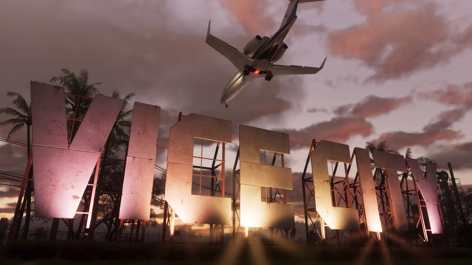 A plane flies above the Vice City sign against a pink sunset sky in Grand Theft Auto VI.